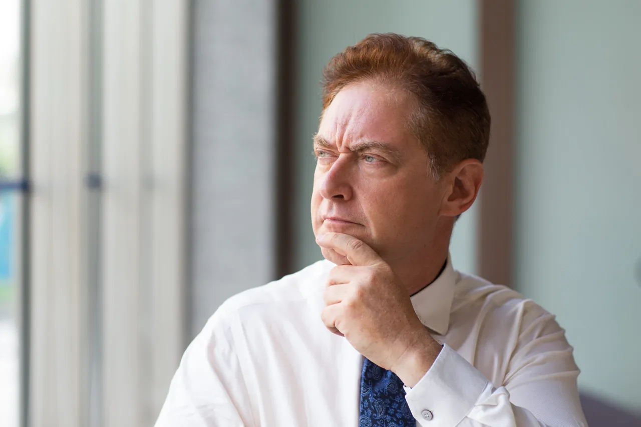Older adult considering future care needs and long-term planning options